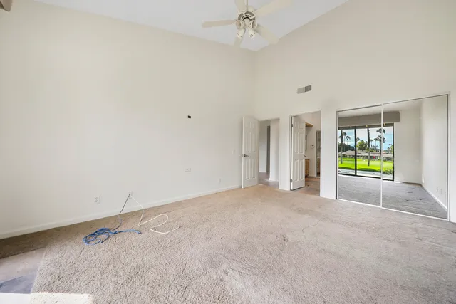 a spacious bathroom with a double vanity sink a and a shower