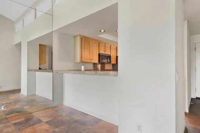a kitchen with a stove top oven sink and refrigerator
