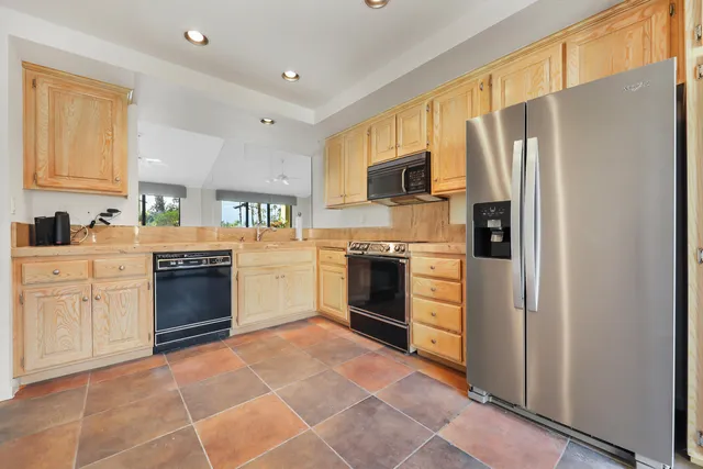 a view of a kitchen with a stove cabinets and a kitchen