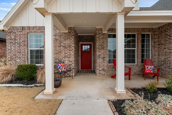 a front view of a house with outdoor seating