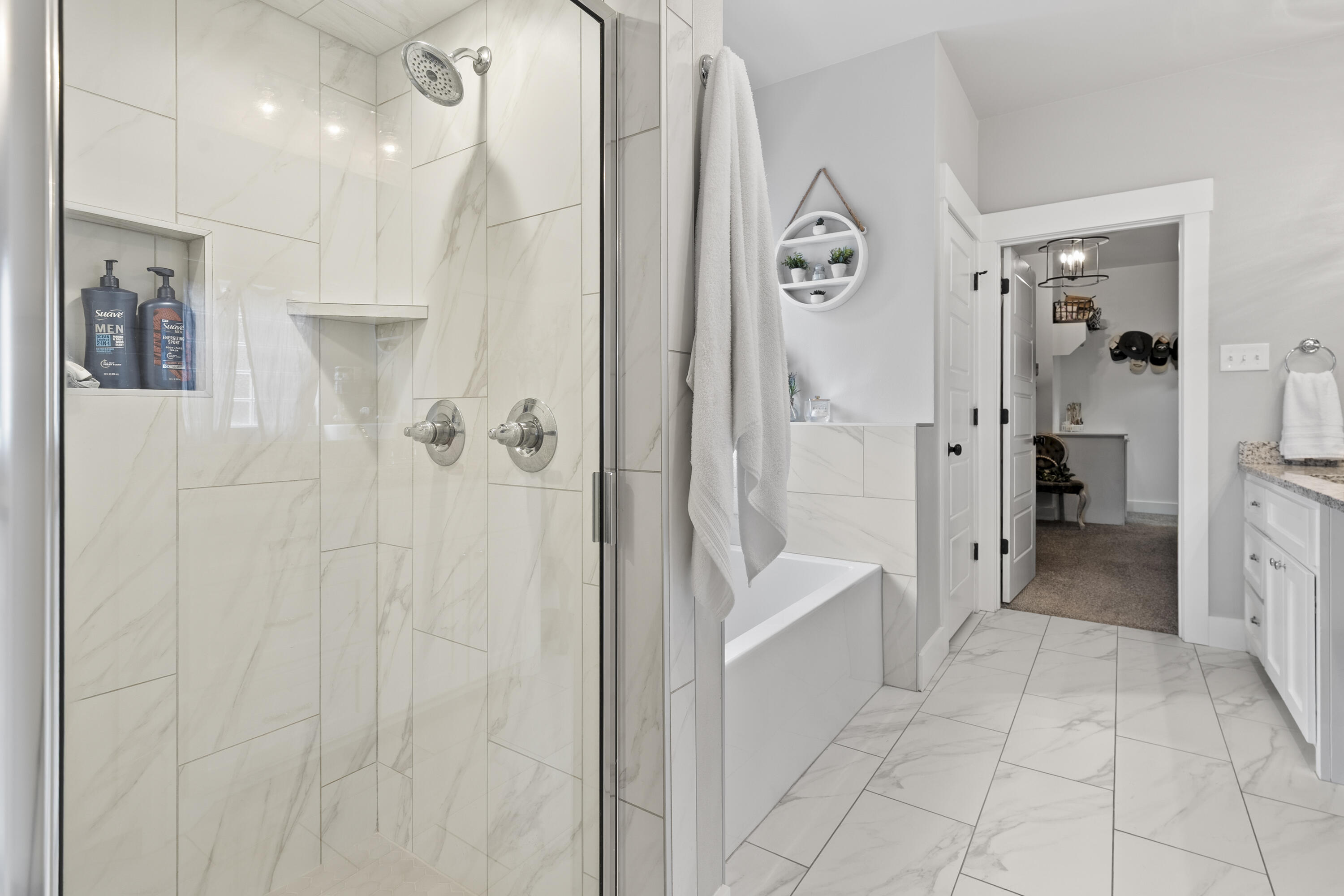 1122 16th Street Shallowater, TX 79363 - Photo 17 of 32 a spacious bathroom with a bathtub and a shower
