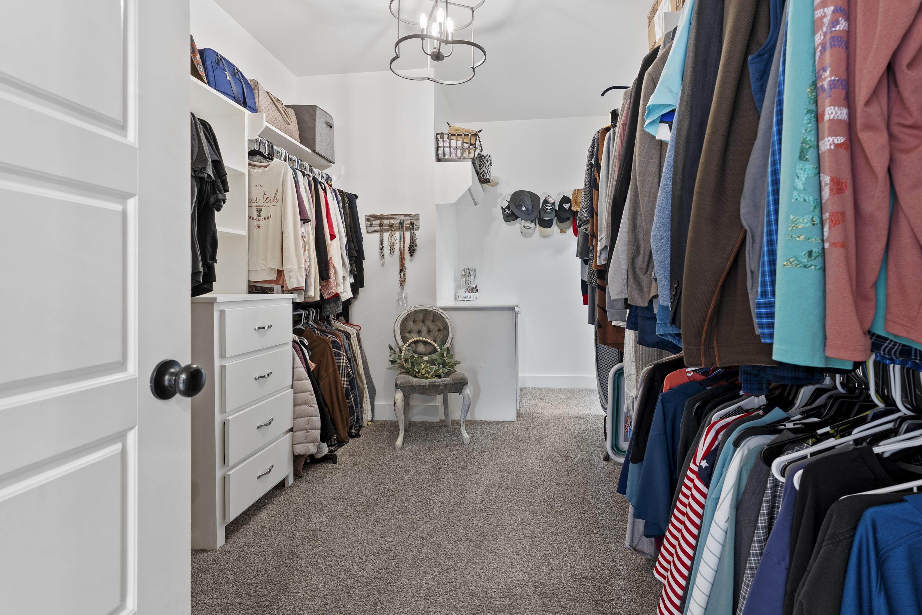 1122 16th Street Shallowater, TX 79363 - Photo 18 of 32 a view of walk in closet with clothes and shoes