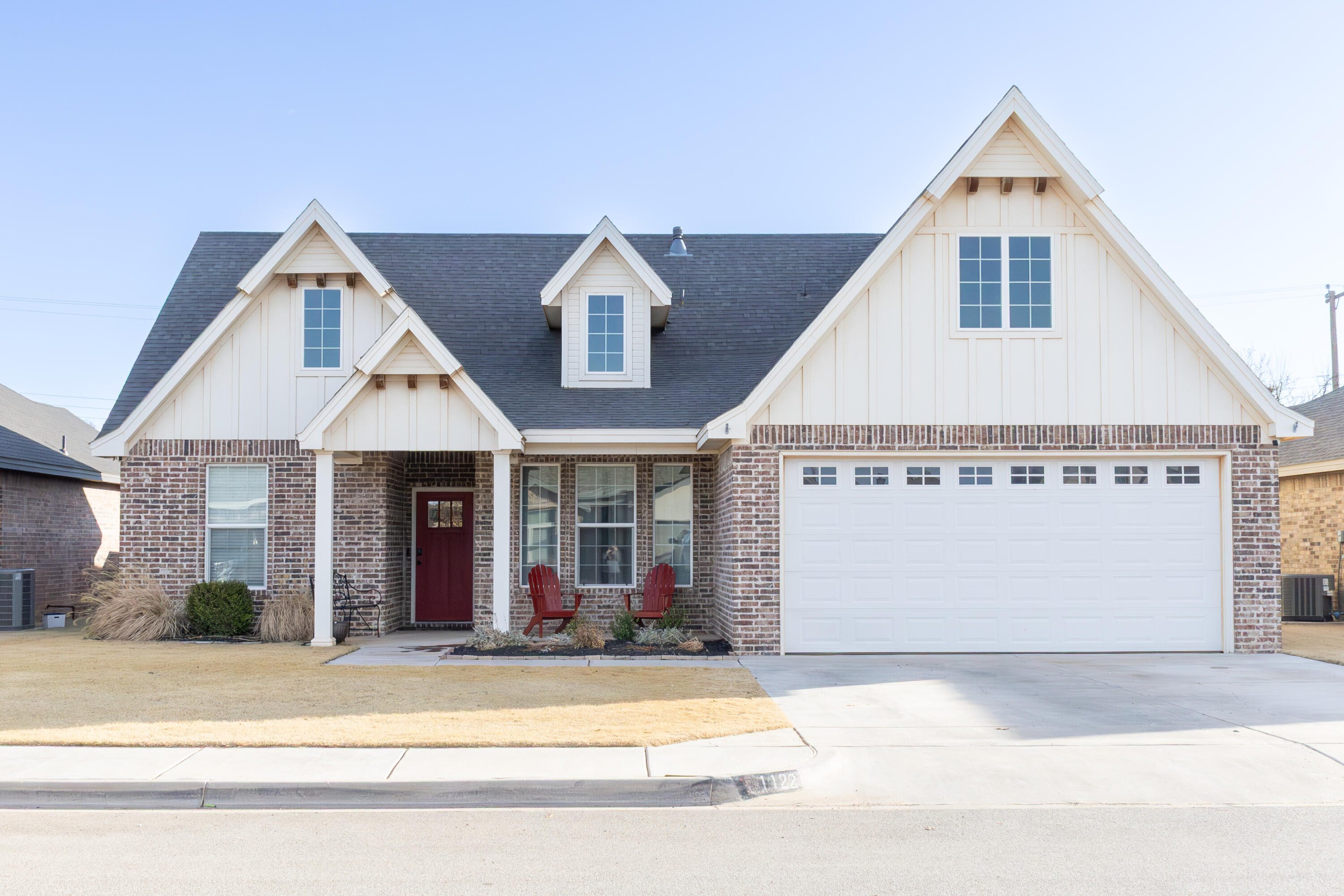 1122 16th Street Shallowater, TX 79363 - Photo 2 of 32 a front view of a house with a yard and garage