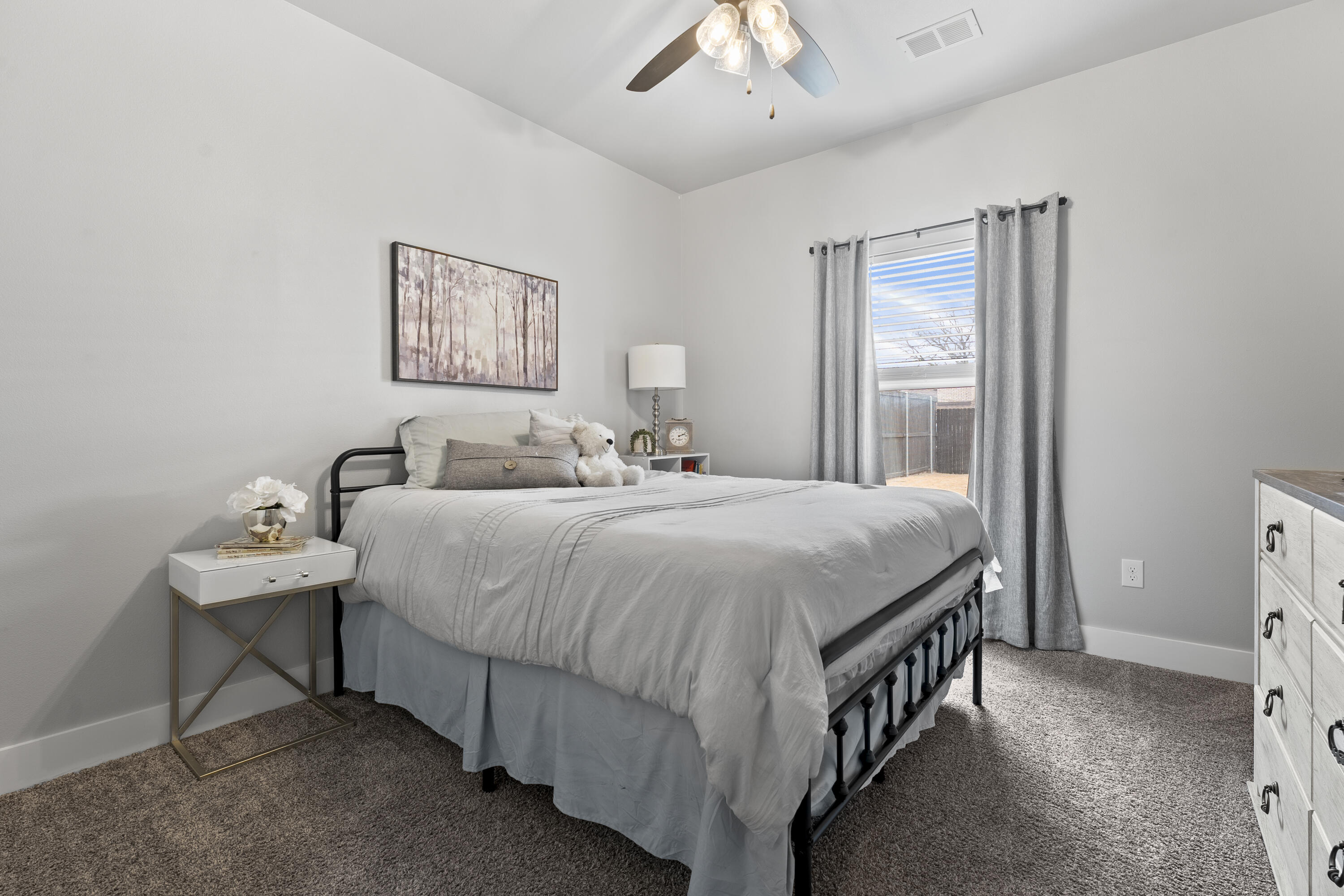 1122 16th Street Shallowater, TX 79363 - Photo 24 of 32 a bedroom with a bed and a desk