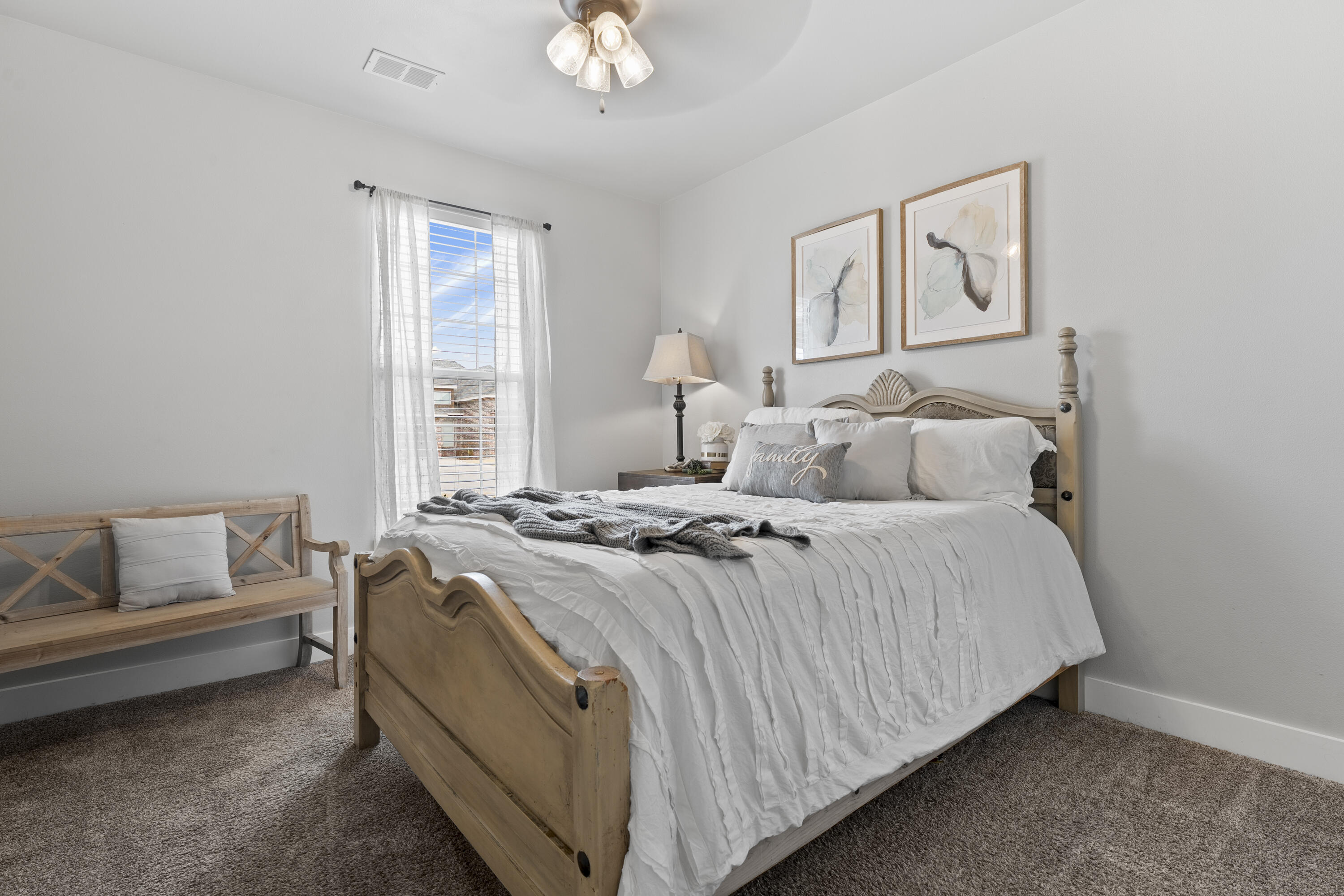 1122 16th Street Shallowater, TX 79363 - Photo 27 of 32 a bedroom with a bed and a couch