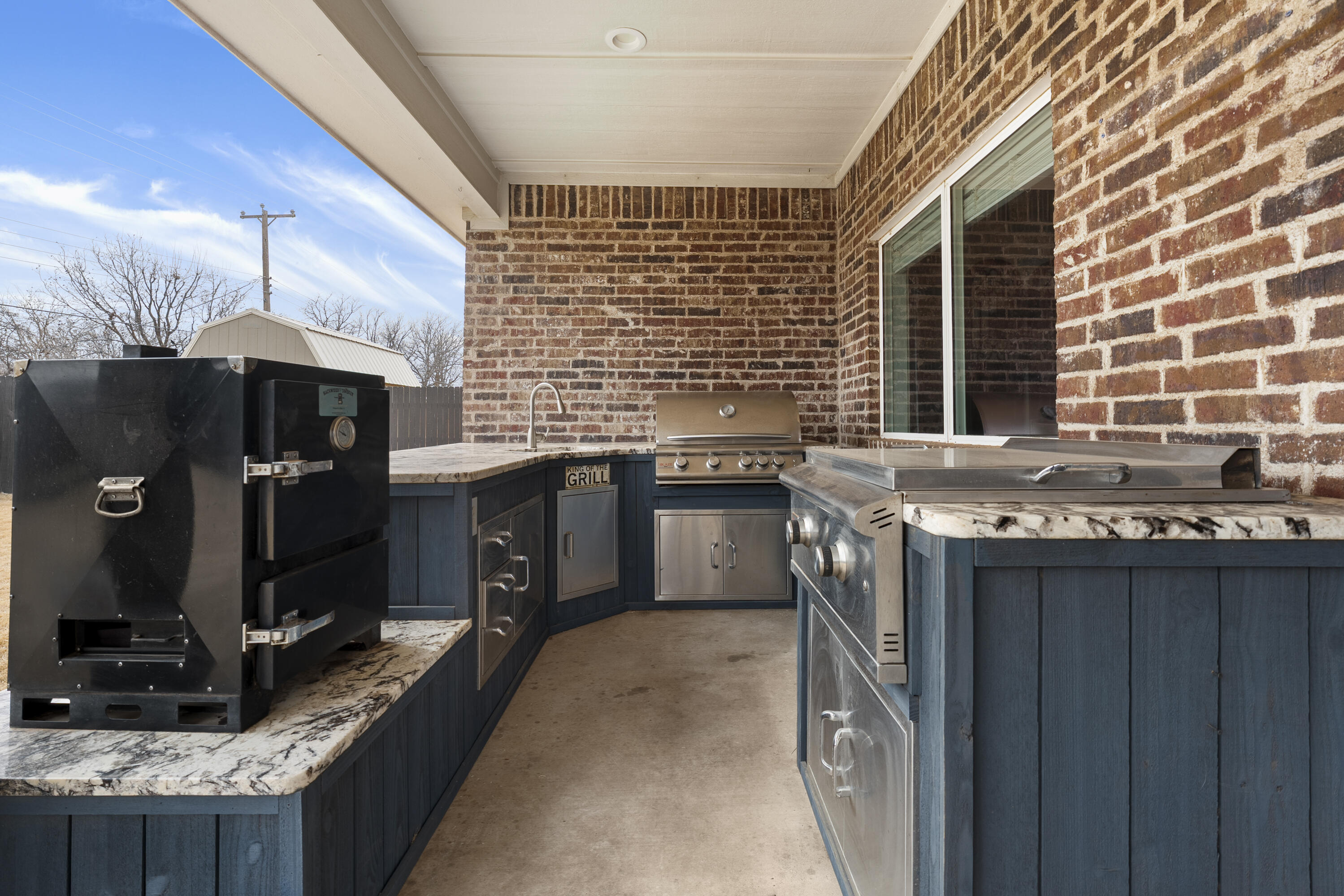 1122 16th Street Shallowater, TX 79363 - Photo 28 of 32 a kitchen with stainless steel appliances granite countertop a sink stove and granite counter top