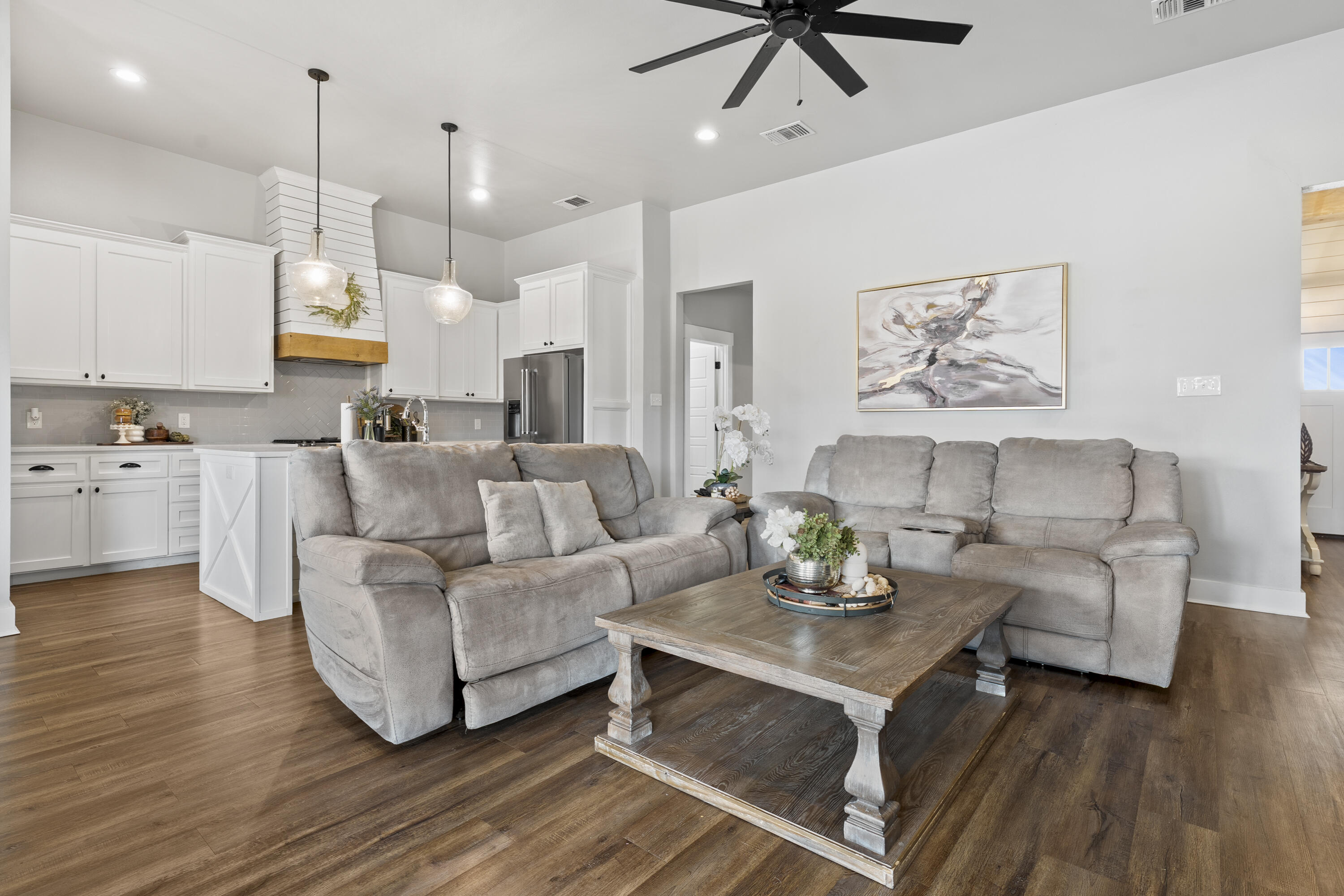 1122 16th Street Shallowater, TX 79363 - Photo 5 of 32 a living room with furniture and a wooden floor