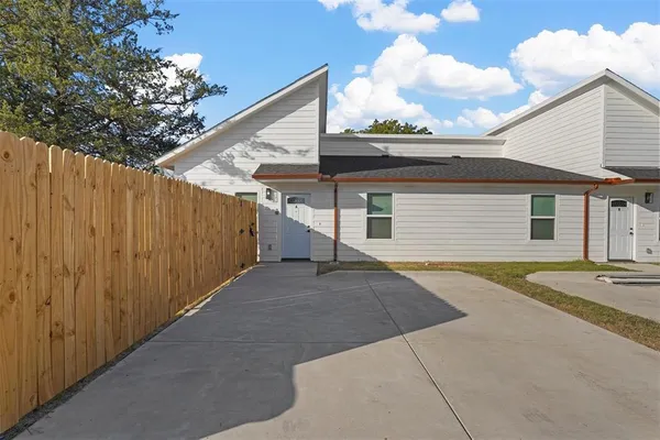 a view of a backyard with a patio
