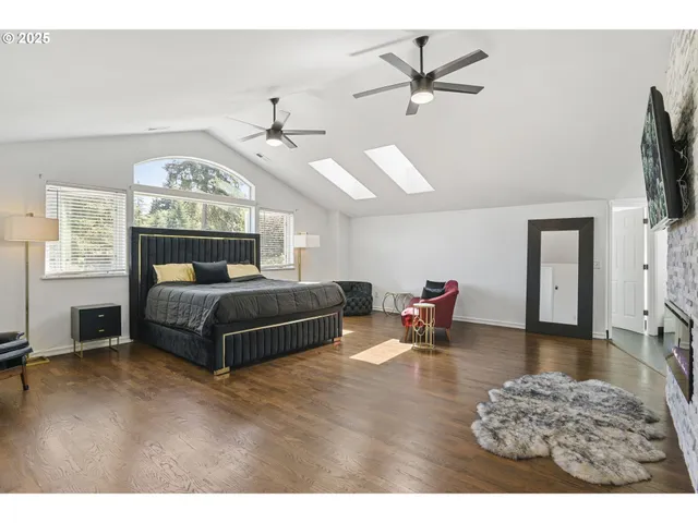 a bedroom with furniture and a chandelier