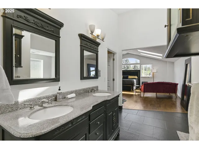 a bathroom with a sink a mirror and a vanity