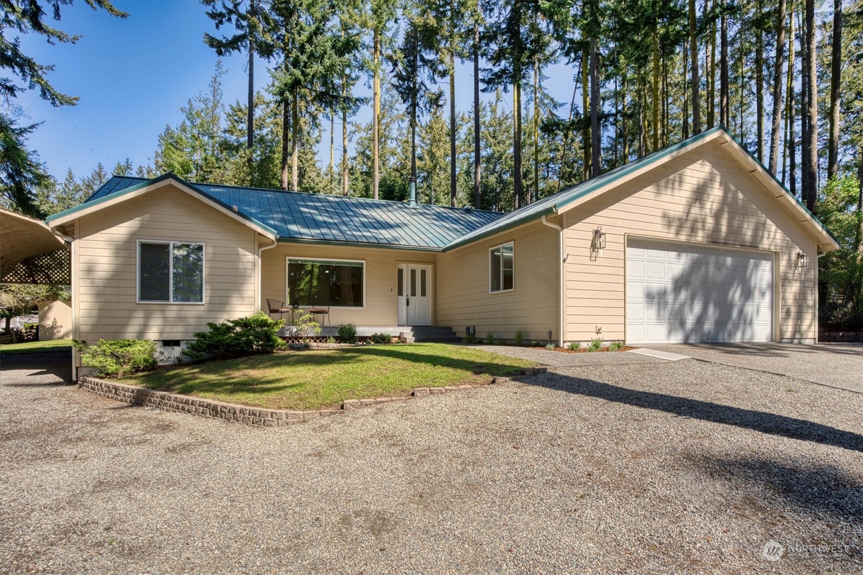 a front view of a house with a yard and porch