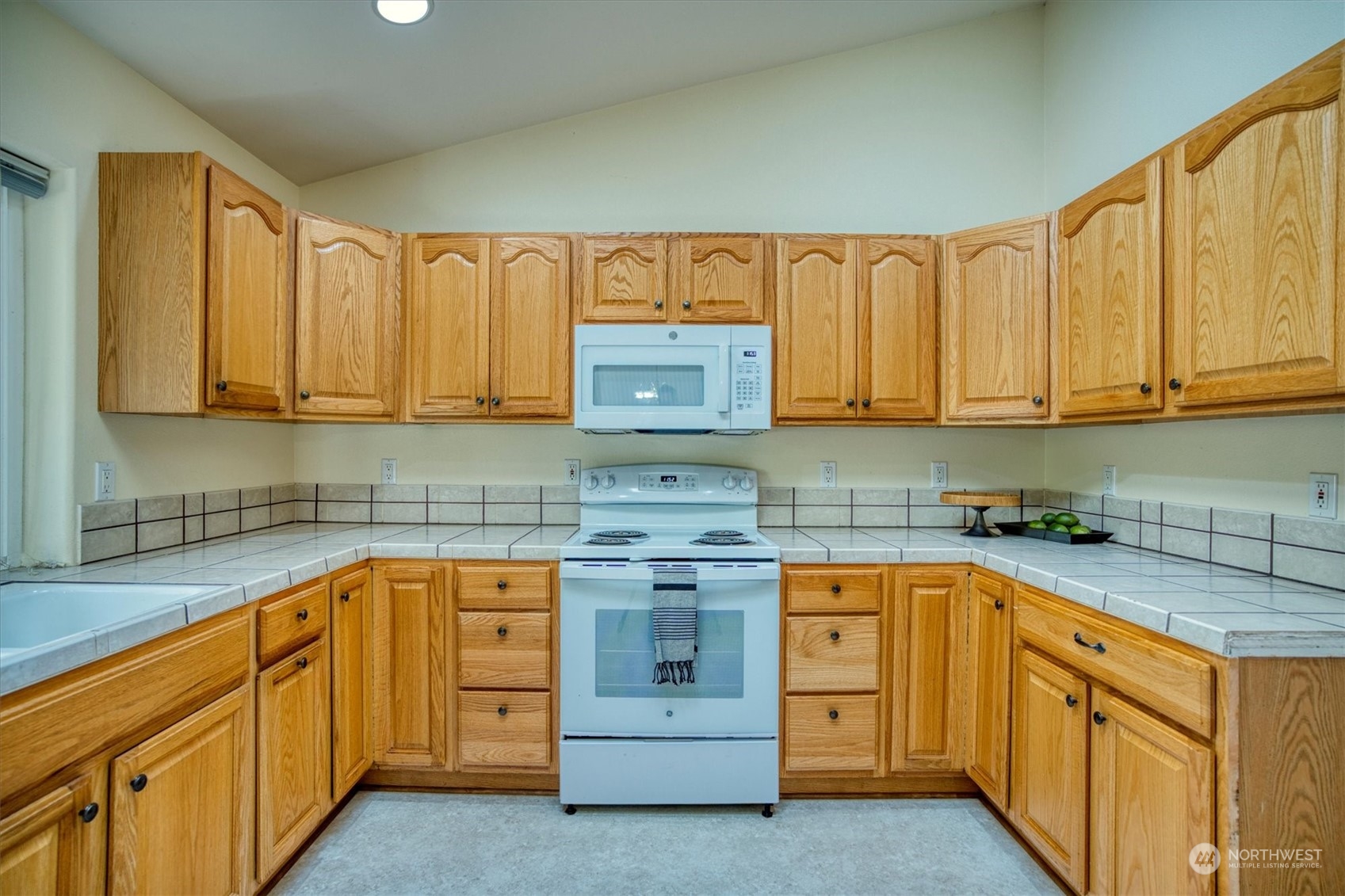 581 Ridge View Drive Sequim, WA 98382 - Photo 11 of 40 a kitchen with stainless steel appliances granite countertop a sink and cabinets