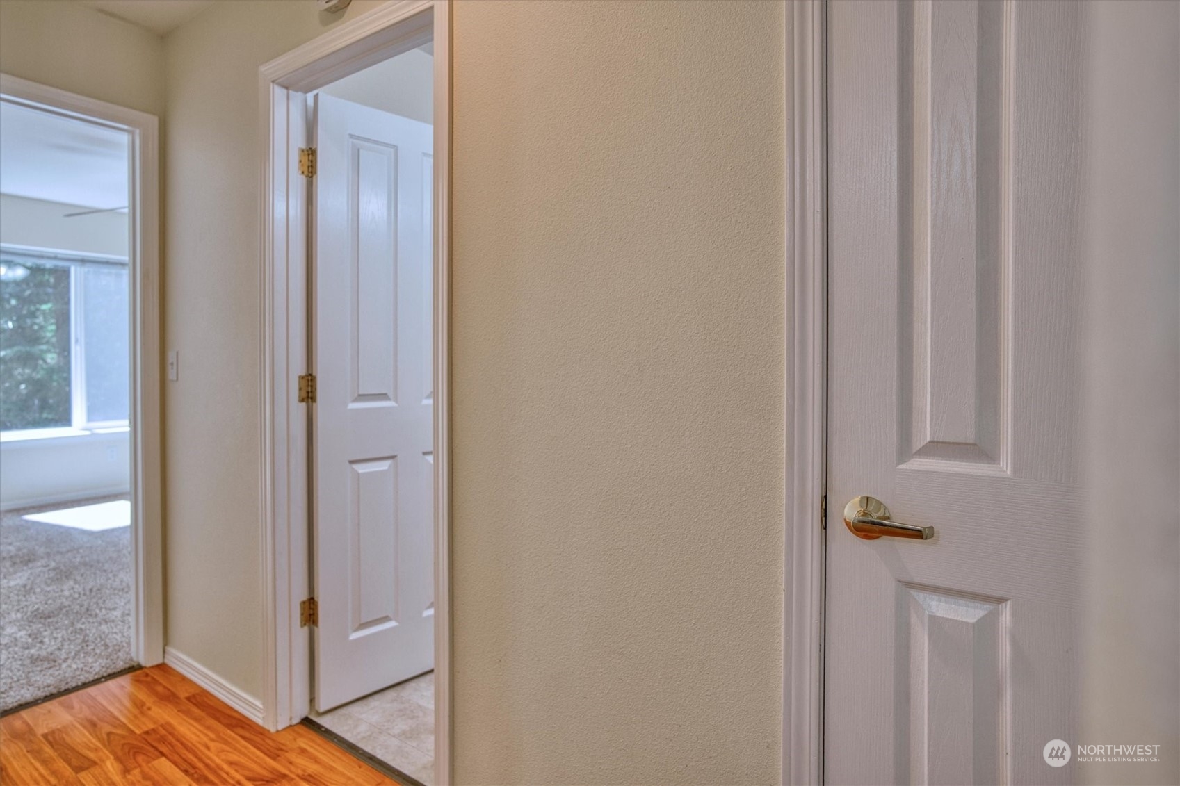 581 Ridge View Drive Sequim, WA 98382 - Photo 22 of 40 a view of a hallway with wooden floor
