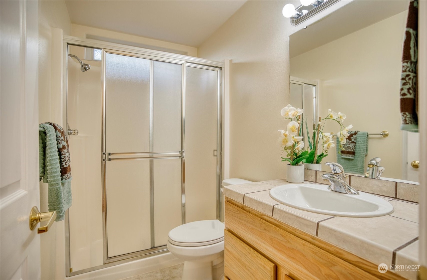 581 Ridge View Drive Sequim, WA 98382 - Photo 25 of 40 a bathroom with a granite countertop sink toilet and shower