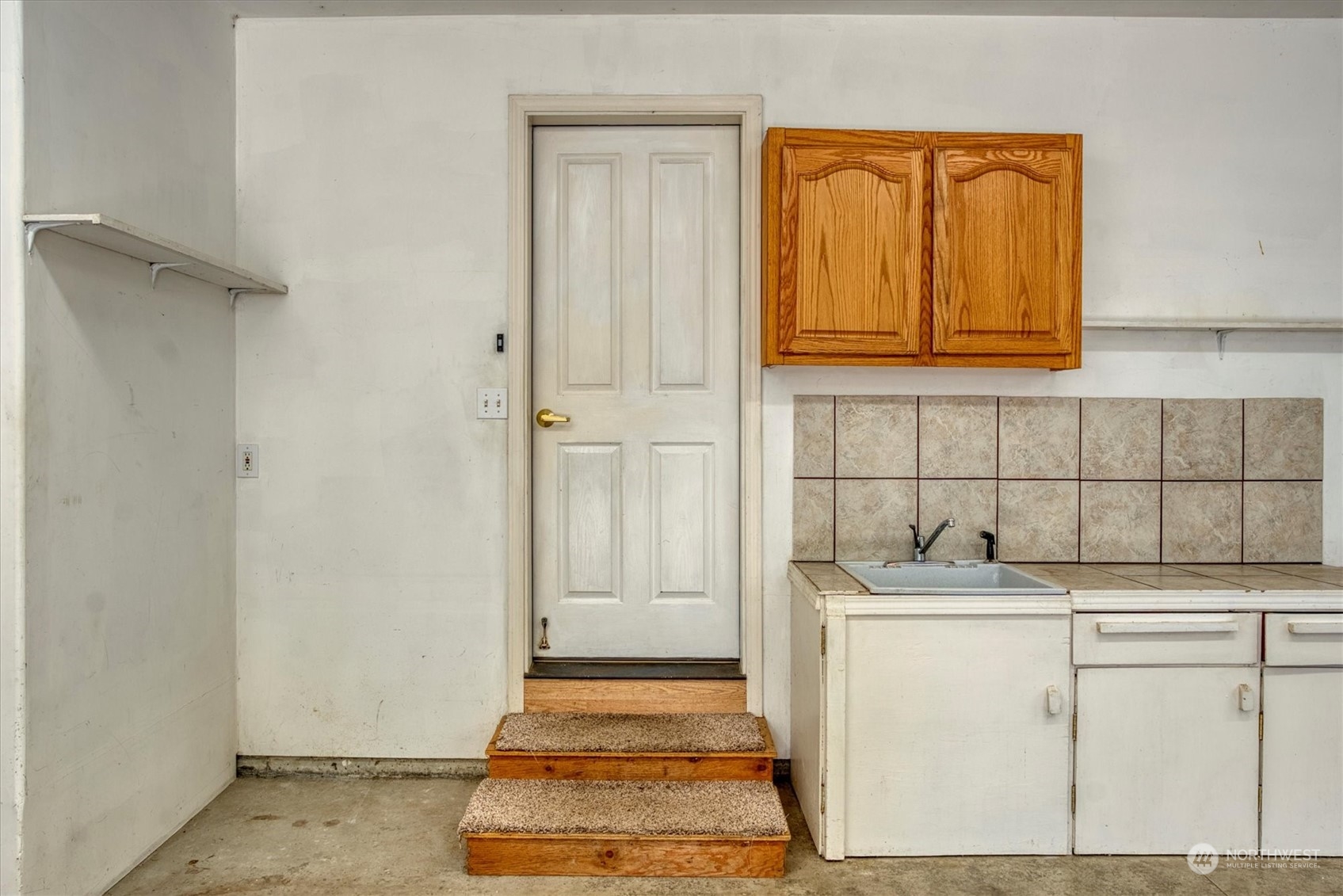 581 Ridge View Drive Sequim, WA 98382 - Photo 31 of 40 a room with washing machine and cabinets