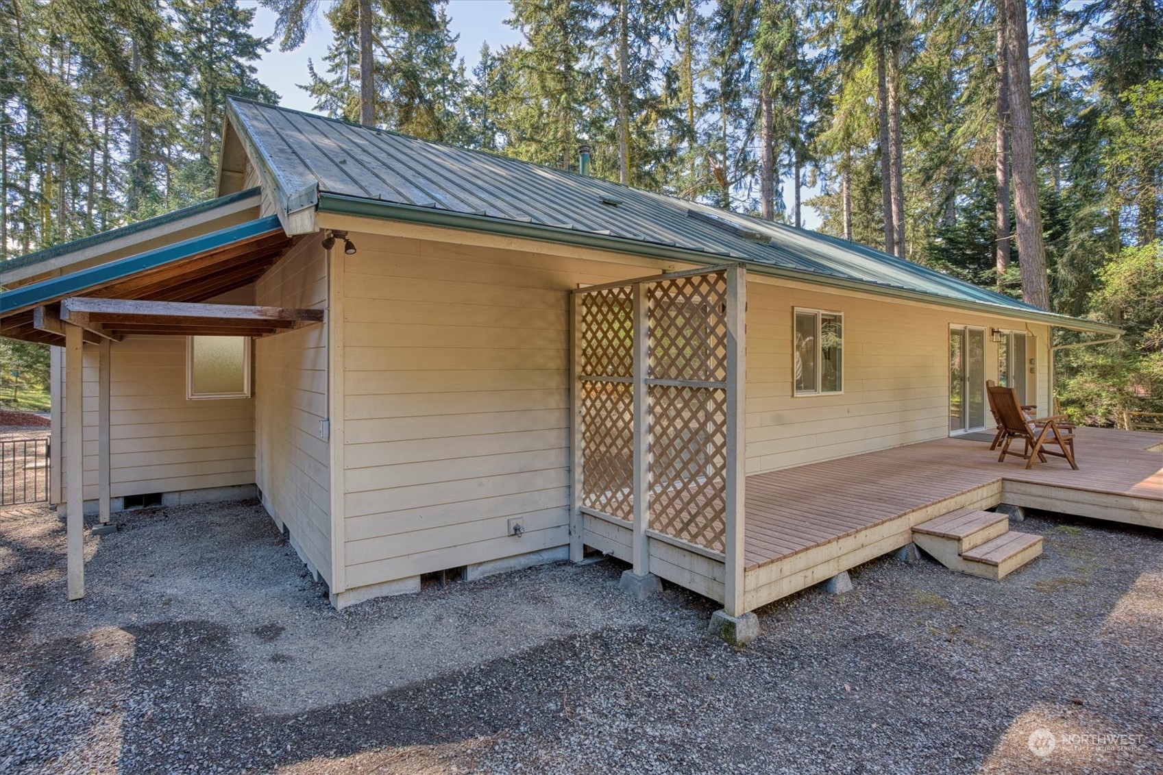 581 Ridge View Drive Sequim, WA 98382 - Photo 36 of 40 a view of backyard with small cabin and a chair