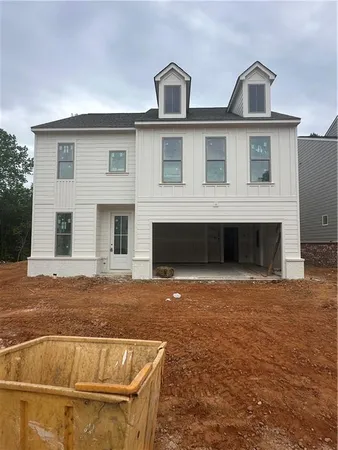 a front view of a house with yard