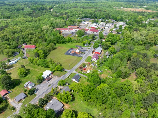 a view of a house with a flower garden