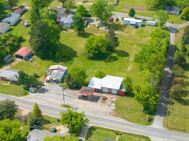 an aerial view of house with yard swimming pool and outdoor seating