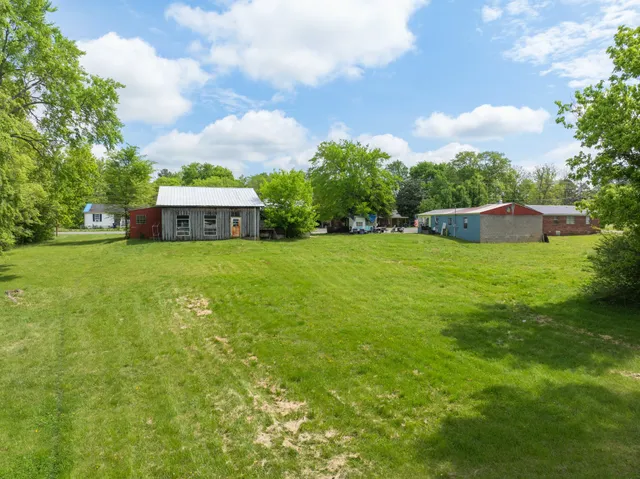 a view of a house with a big yard