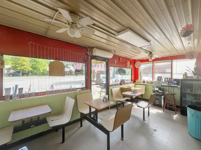 a dining room with furniture and outdoor space