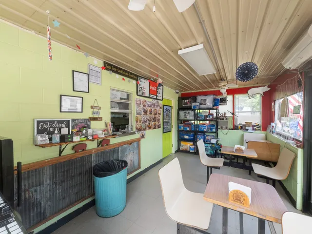 a dining room with furniture and a chandelier