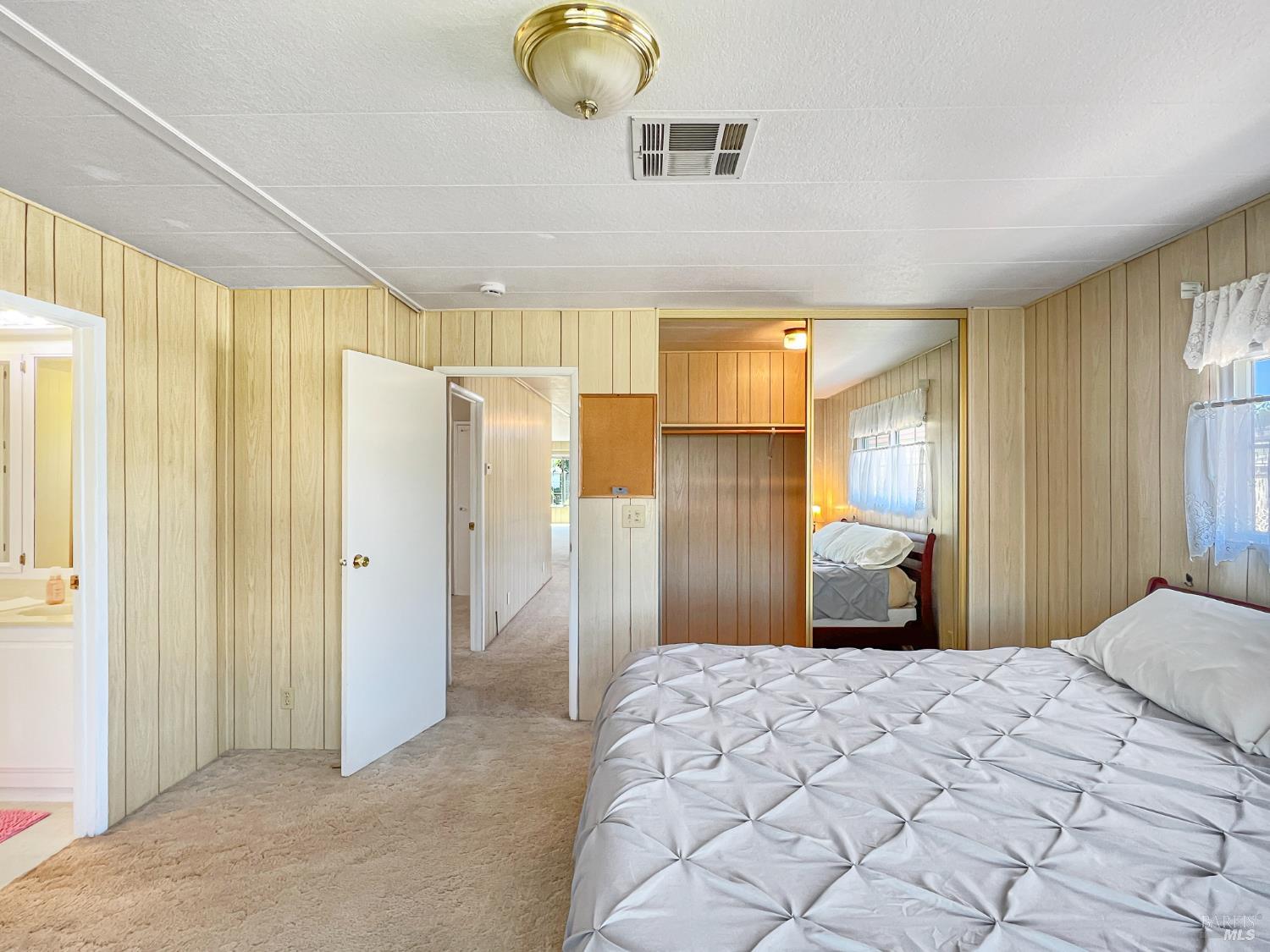 85 Estrella Drive Santa Rosa, CA 95403 - Photo 10 of 27 a bedroom with a large bed and a window