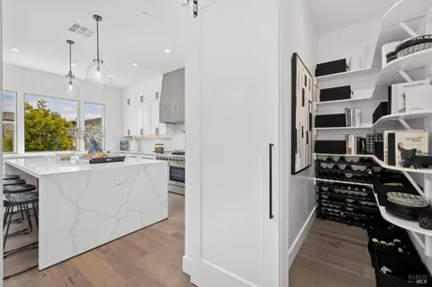 a kitchen with stainless steel appliances granite countertop a stove and a refrigerator