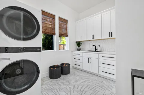 a kitchen with a washer and dryer