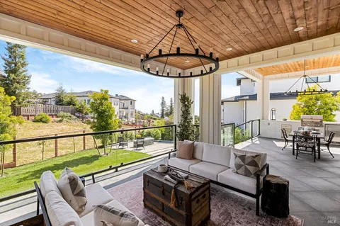 a view of a chairs and table in patio