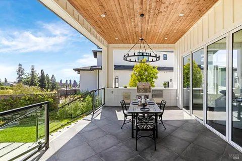 a view of balcony with furniture