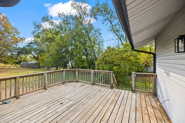 a view of balcony with wooden floor