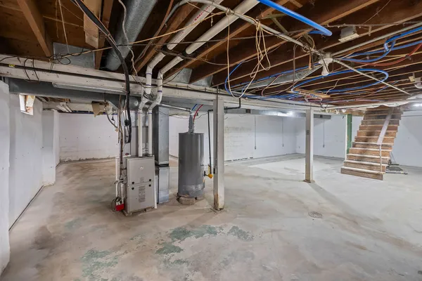 a view of empty room with wooden walls