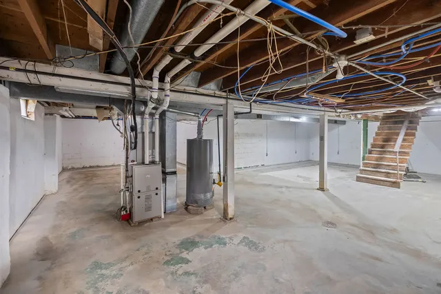a view of empty room with wooden walls