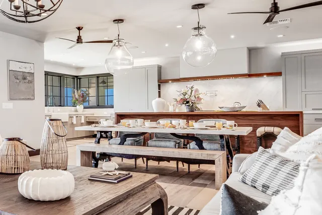 a kitchen with a table and chairs in it