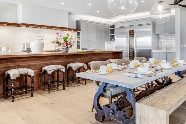 a dinning table and chairs in a room
