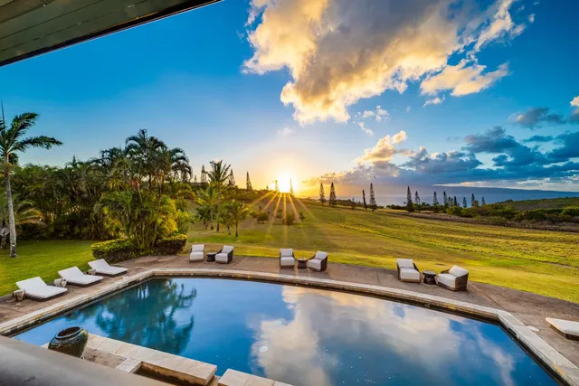 a view of a swimming pool from a lounge chair