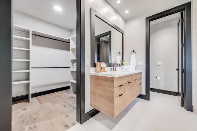 a bathroom with a sink double vanity and a mirror