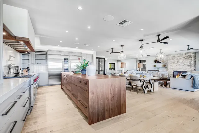 a large white kitchen with lots of counter top space