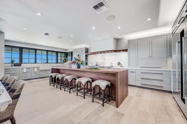 a view of a dining area with furniture and chandelier