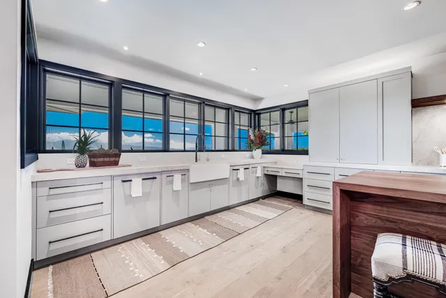 a kitchen with stainless steel appliances kitchen island granite countertop a stove and cabinets