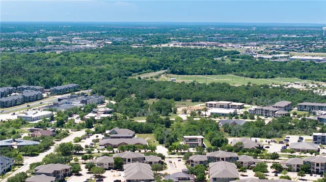 an aerial view of a house having yard
