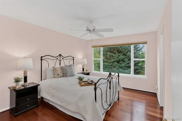 a bedroom with a bed next to a window