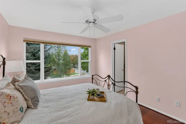 a bed room with a bed and a chandelier