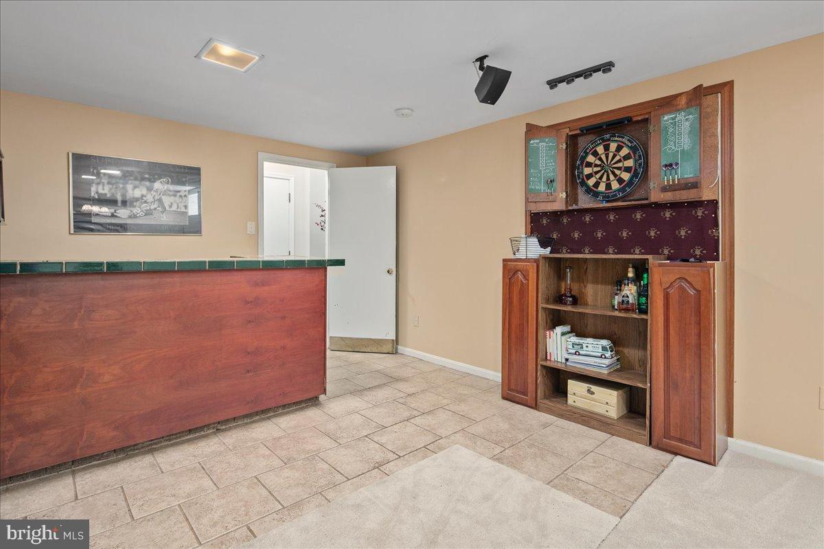 12421 Henderson Road Clifton, VA 20124 - Photo 57 of 90 Inviting entertainment space with dartboard