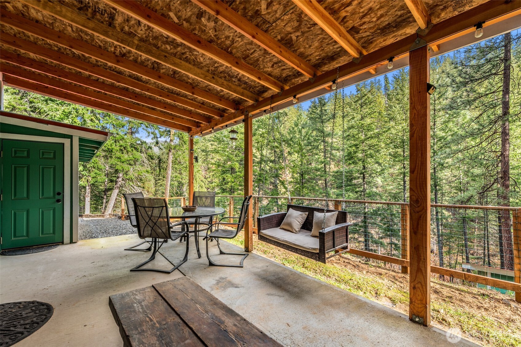 695 Sand Creek Road Cashmere, WA 98815 - Photo 11 of 40 a balcony with furniture and outdoor view