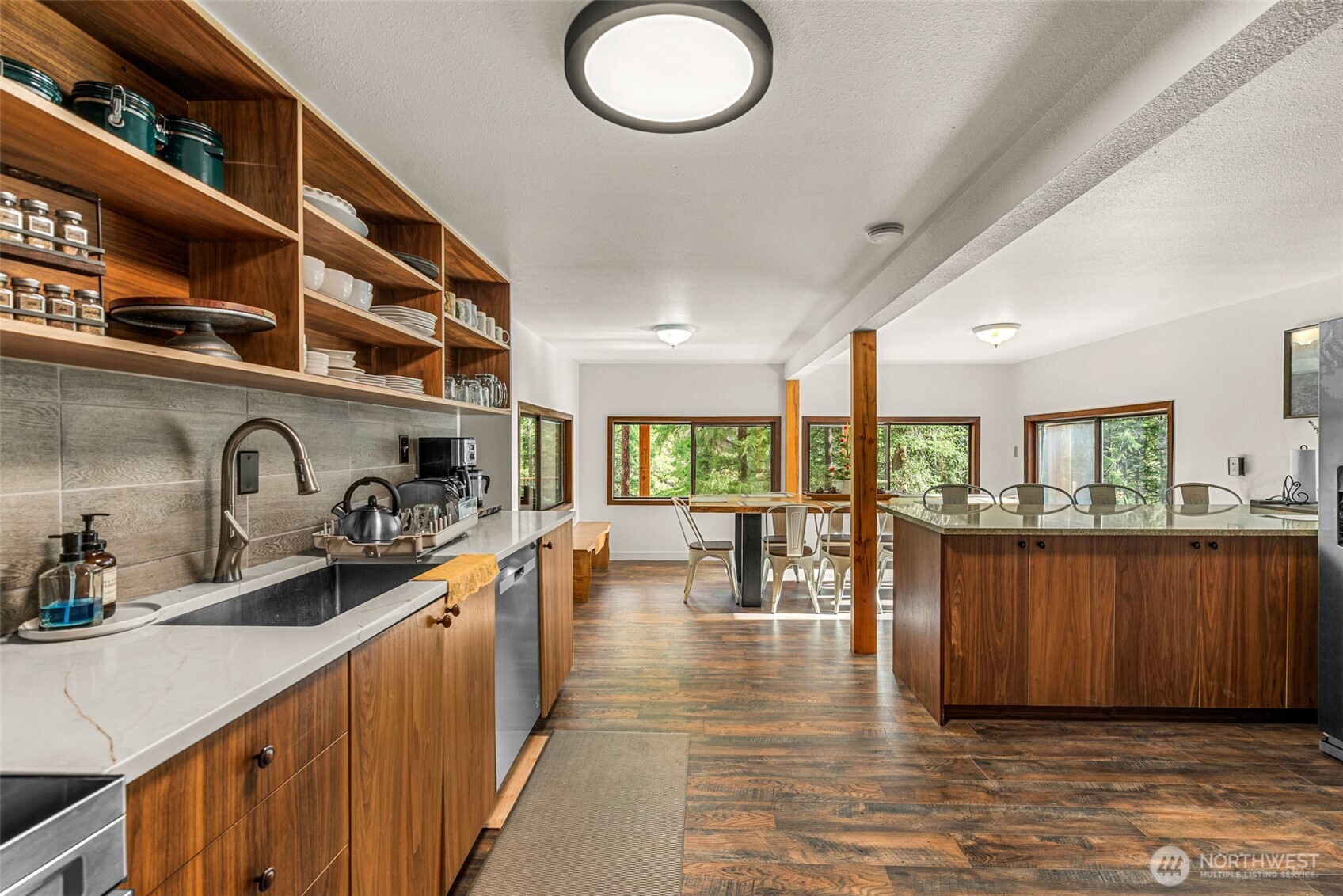 695 Sand Creek Road Cashmere, WA 98815 - Photo 22 of 40 a kitchen with lots of counter top space and dining table