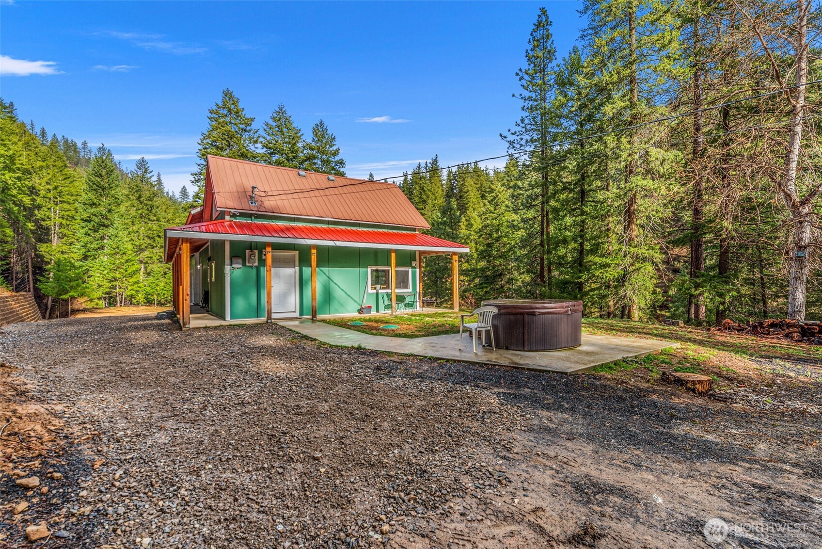 695 Sand Creek Road Cashmere, WA 98815 - Photo 31 of 40 a view of a house with backyard and porch