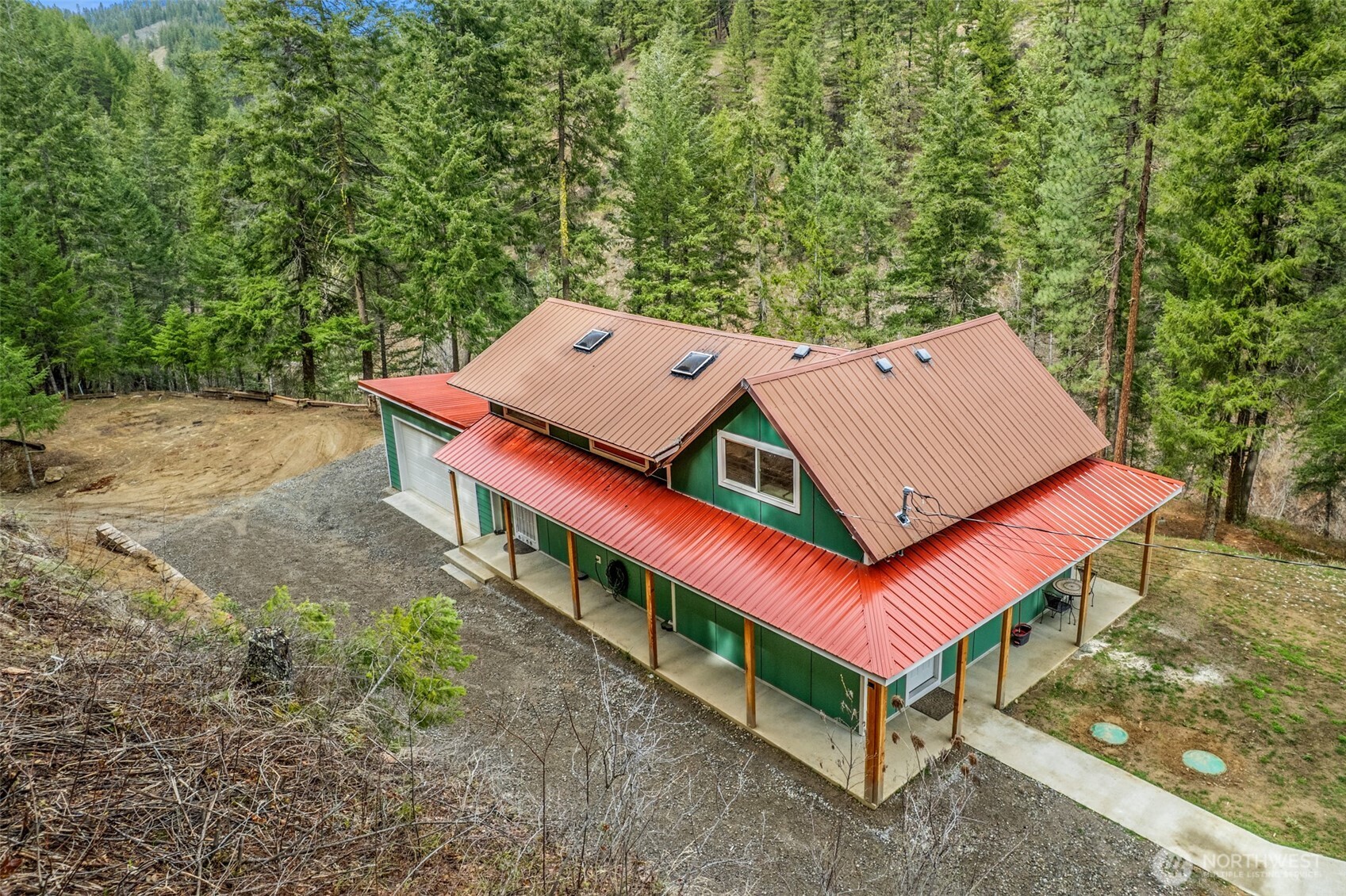695 Sand Creek Road Cashmere, WA 98815 - Photo 32 of 40 an aerial view of a house with balcony and trees