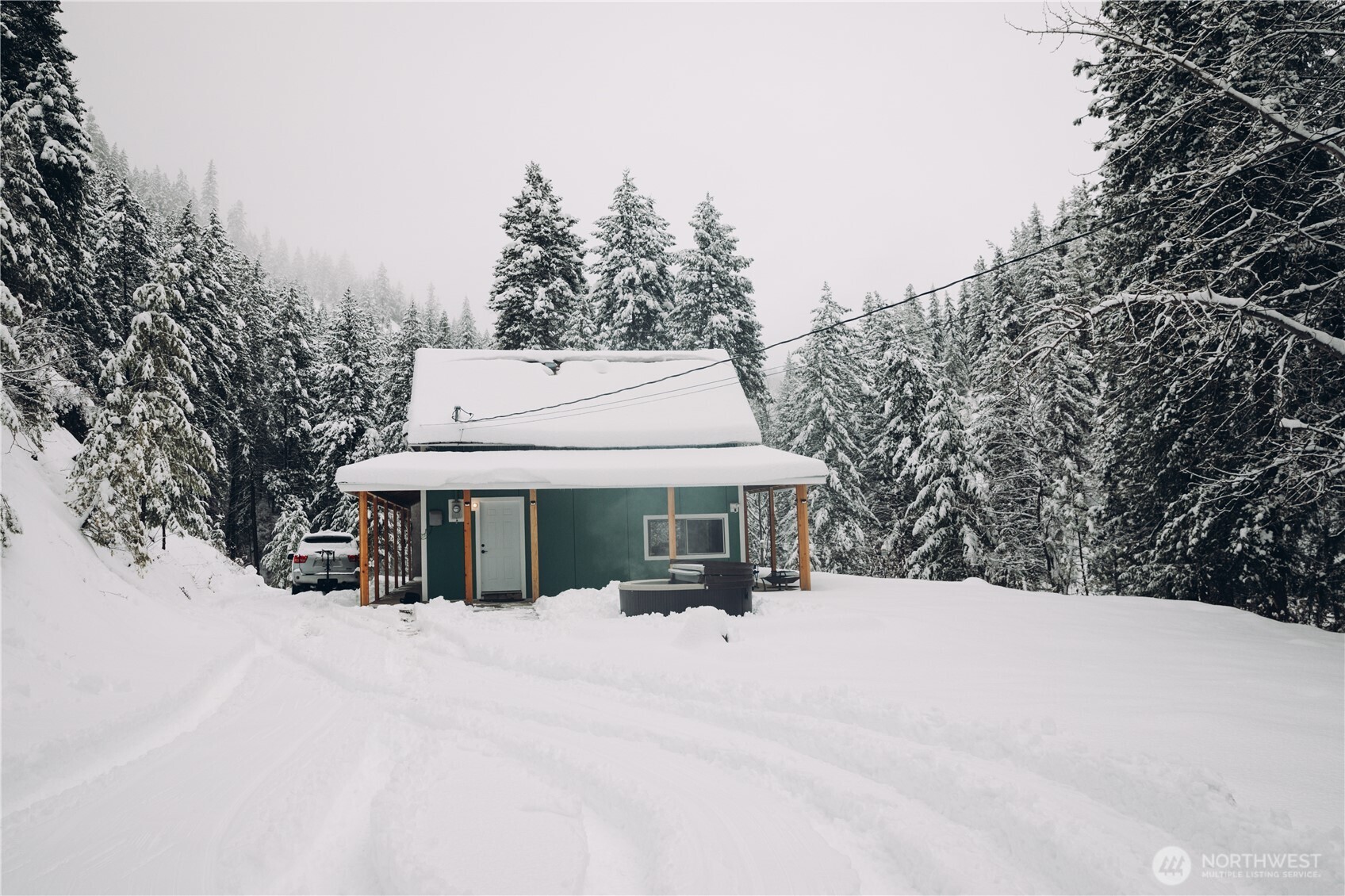 695 Sand Creek Road Cashmere, WA 98815 - Photo 37 of 40 a view of house with a yard covered in snow